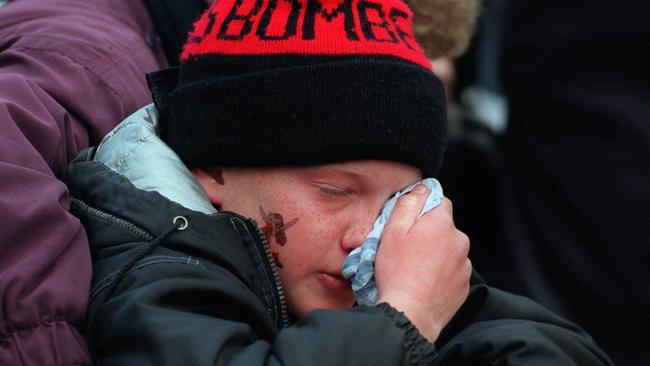 A young Essendon fan can’t believe the result. Picture: Michael Dodge