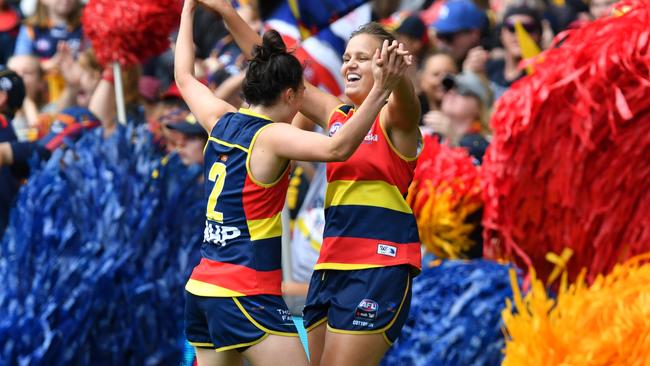 Danielle Ponter celebrates with Eloise Jones of the Adelaide Crows after scoring a goal during the AFLW Grand Final match between the Adelaide Crows and Carlton Blues at the Adelaide Oval, Adelaide, Sunday, March 31, 2019. (AAP Image/David Mariuz) NO ARCHIVING, EDITORIAL USE ONLY