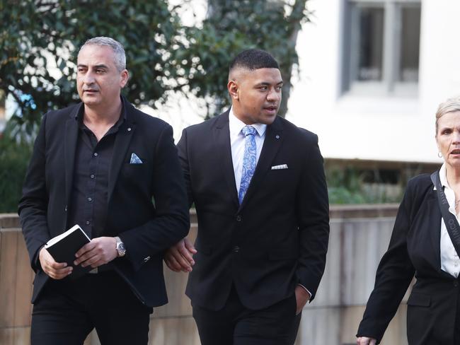Manase Fainu (centre) arrives at Parramatta courthouse for the start of his trial. Picture: John Grainger