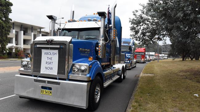 Trucks circle Parliament House during a rally opposing the Road Safety Remuneration Tribunal Payment Order in Canberra in 2016. Picture: AAP Image/Mick Tsikas