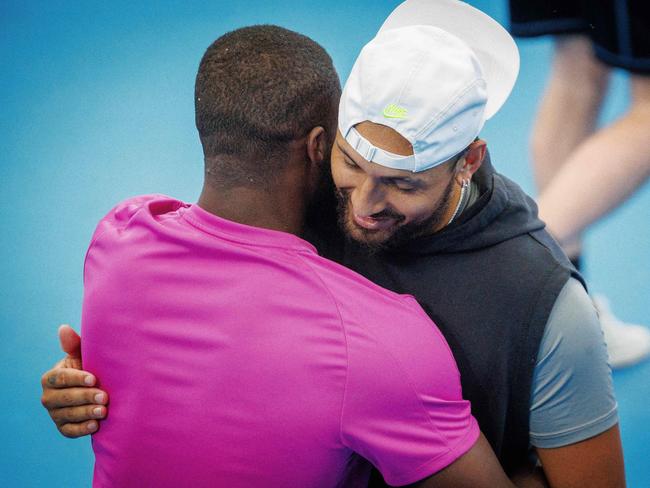 American Frances Tiafoe (L) embraces Nick Kyrgios (R) during a training session. Picture: AFP