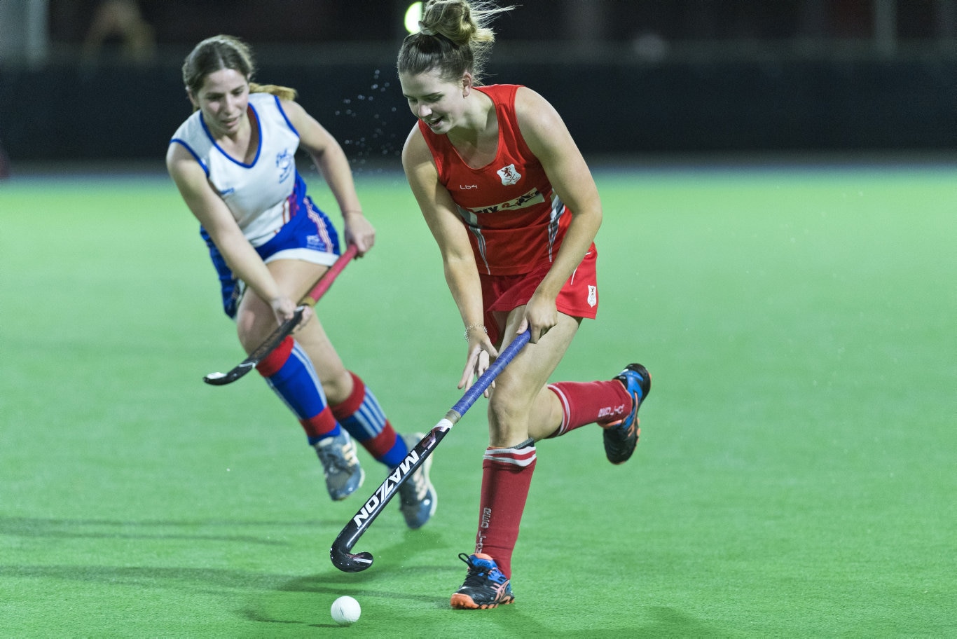 Tannah Hood (left) of Rangevillle gives chase to Emma Henare of Red Lions in Toowoomba Hockey COVID Cup women round two at Clyde Park, Friday, July 17, 2020. Picture: Kevin Farmer