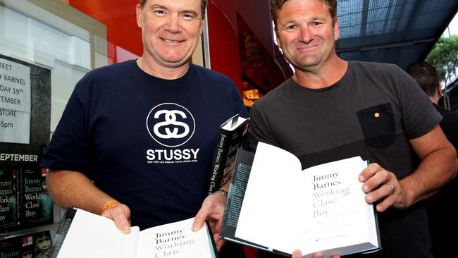 Big Jimmy Barnes fan Lee Newton of Kellyville and Rouse Hill’s Greg Thomas with their signed copies of the book.