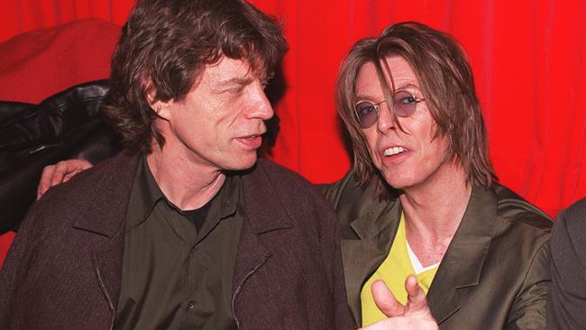 LONDON - DECEMBER 2: Singers David Bowie (R) and Mick Jagger (L) at POP in Soho, London on December 2, 1999. They were attending the aftershow party for Bowie's gig at the Astoria that evening. (Photo by Gareth Davies/Getty Images)