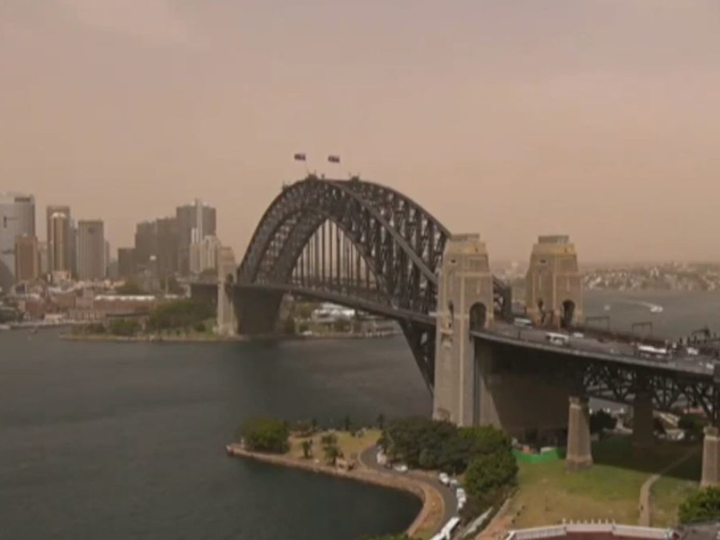 Sydney Harbour took on a reddish tinge about 11.30am. Picture: Channel 7