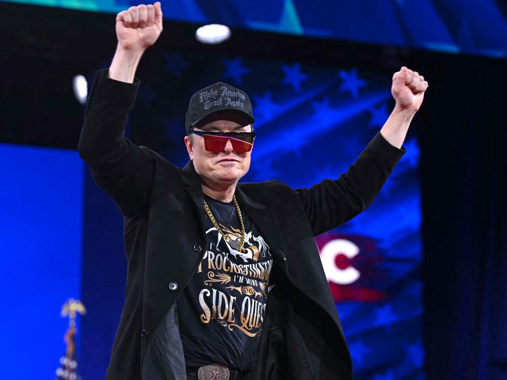 Elon Musk walks on stage during the annual Conservative Political Action Conference. The hacker who played a video of Donald trump kissing Musk’s feet has been apprehended. Picture: AFP