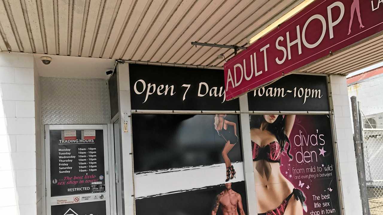 Adult shop robbed by man armed with hammer | The Courier Mail