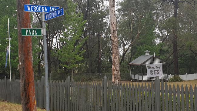 The road leading into the L3 fire trail where lightning struck a tree. A sign thanking the RFS is visible in the background. Picture: Isabell Petrinic