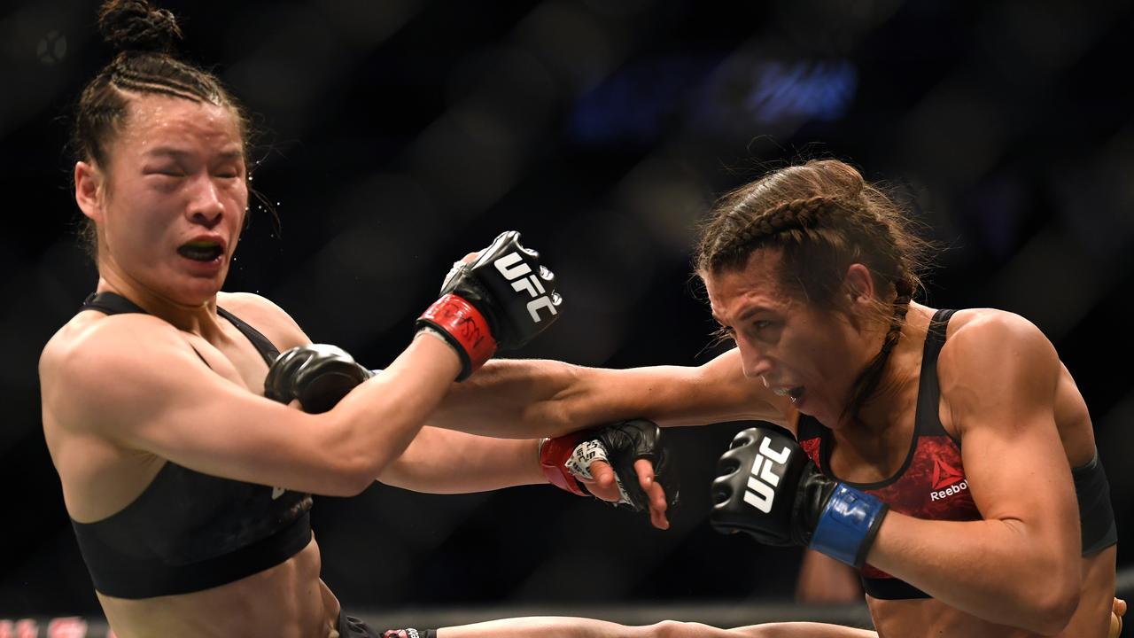 Weili Zhang takes a punch form Joanna Jedrzejczyk.