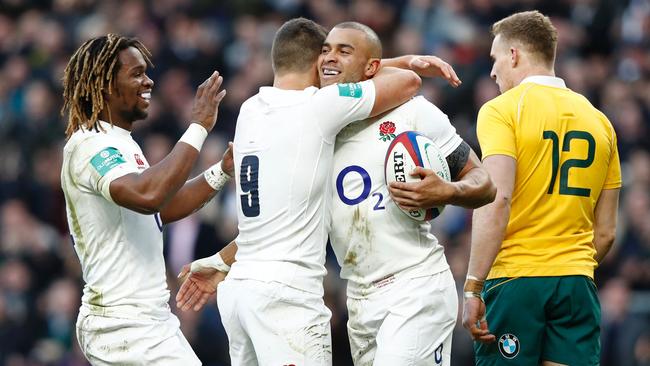 England centre Jonathan Joseph celebrates with scrumhalf Ben Youngs.