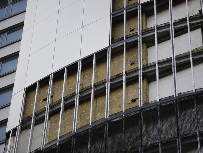 Panels of external cladding are removed from the facade of Braithwaite House in London in the wake of the Grenfell Tower fire. Picture: AFP/Tolga Akmen