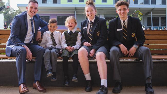 Principal Darren Cox with students - Average Year 9 results at St Philip's Christian College - Cessnock, in Nulkaba, increased by 4.8 per cent. Supplied.