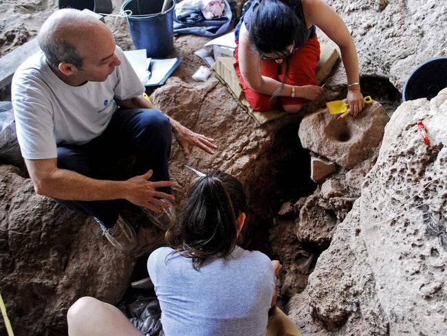 Archaeologists from Haifa University at an excavation in a cave near Raqefet searching for evidence of beer brewing in a Natufian burial cave dating back 13,000 years ago. Picture: AFP