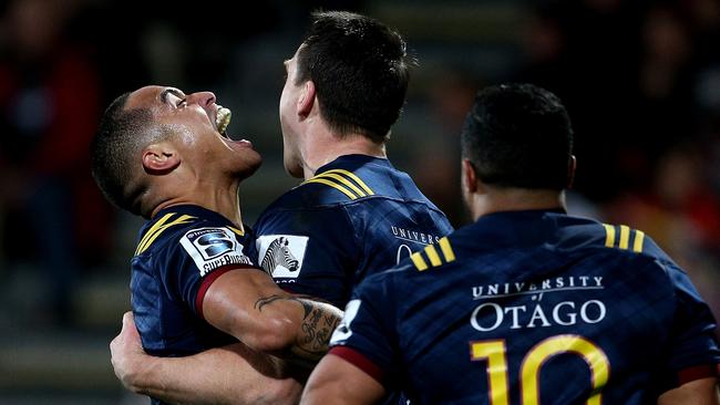 Highlanders halfback Aaron Smith celebrates Ben Smith’s try.