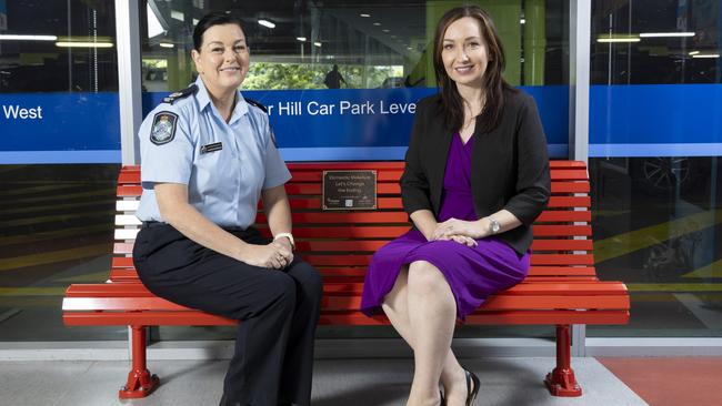 Acting senior sergeant Sharon Morgan and Rebecca Latham unveiled the Mater red bench as part of Domestic Violence Awareness month. Picture: Richard Walker