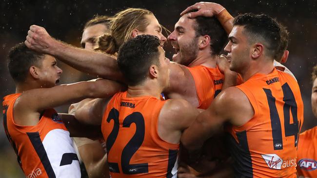 Jeremy Finlayson celebrates a goal with his Giants teammates. Picture: Phil Hillyard