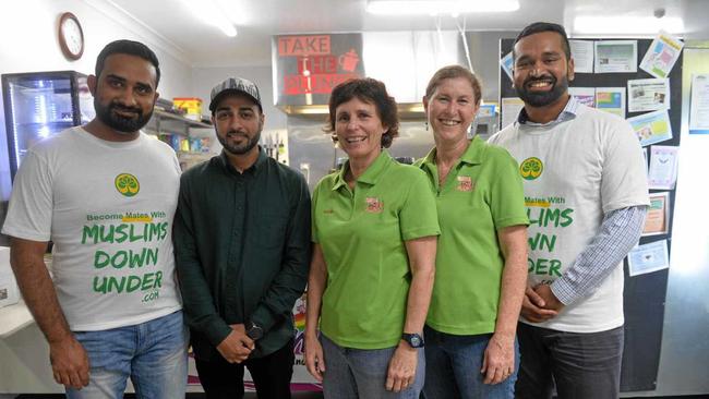 NO DIVIDE: Muslims Down Under members Ali Basil, Salman Mansoor and Sheeraz Sirajur Raheem with Justine Halpin and Beth Boorer from Take Tthe Plunge Cafe at Kepnock. Picture: Rhylea Millar