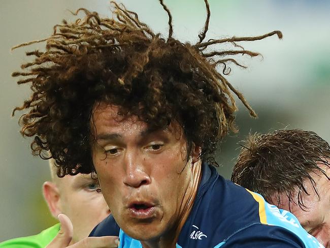 GOLD COAST, AUSTRALIA - MARCH 11:  Kevin Proctor of the Titans is tackled during the round one NRL match between the Gold Coast Titans and the Canberra Raiders at Cbus Super Stadium on March 11, 2018 in Gold Coast, Australia.  (Photo by Chris Hyde/Getty Images)