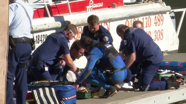 Paramedics work on the three-year-old after she was pulled from the water. Picture: TNV