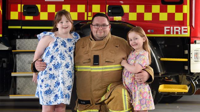 Ash Blain with his daughters Evie, left, and Georgia, right. Picture: David Smith