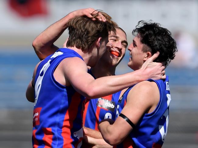 Oakleigh players celebrate a goal. Picture: Andy Brownbill