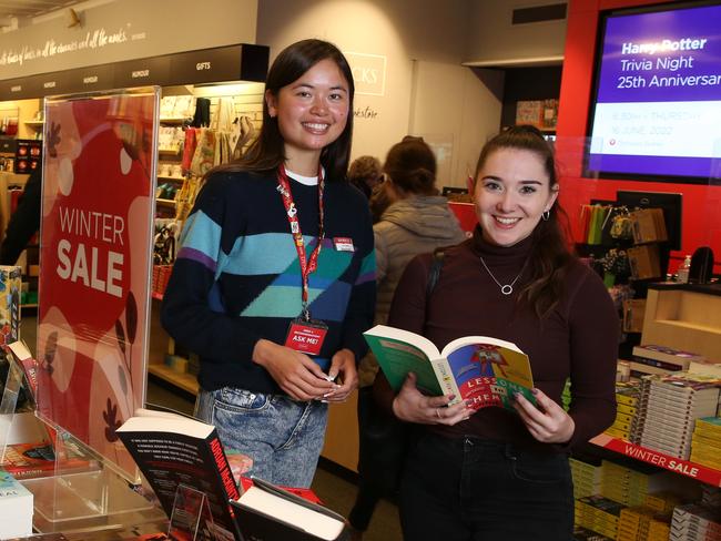 10/06/2022. Dymocks book store employee Stephanie Thelin with customer Nicole Ellery, 26 from Newcastle (M) 0458519095 at the company's flagship store in George Street, in Sydney's CBD.  Dymocks is opening new stores, following their success with their physical retail store spaces. Britta Campion / The Australian