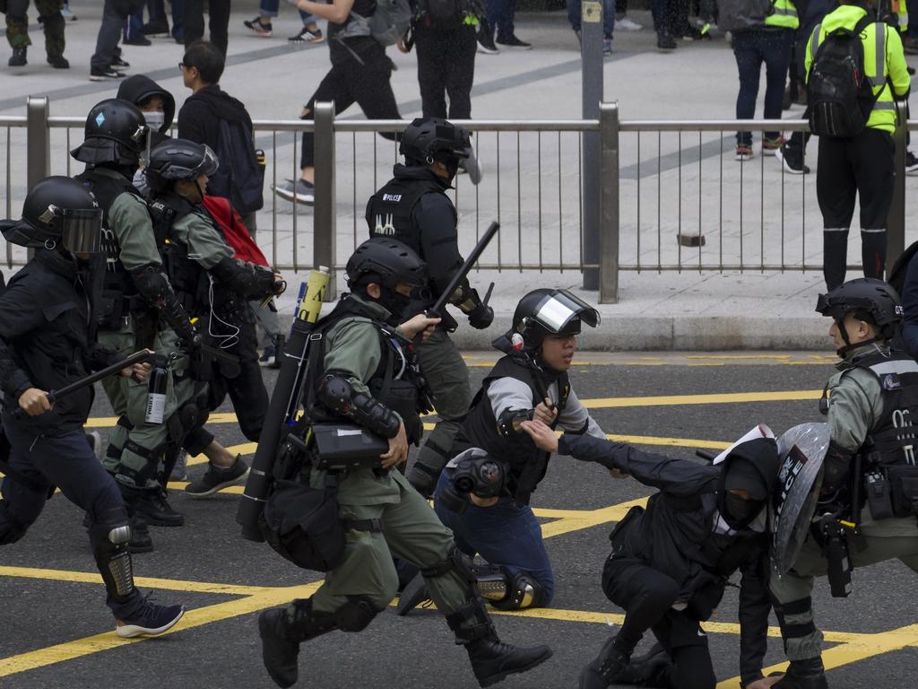 Riot police clash with protesters in a new outbreak of violemce. Picture: AP Photo/Ng Han Guan