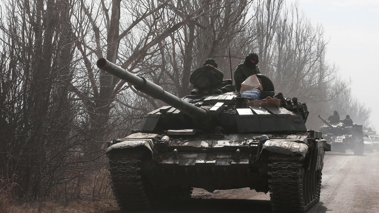 Pro-Russian troops in uniforms without insignia are seen atop a tank outside the separatist-controlled town of Volnovakha in the Donetsk region on March 15, 2022. Picture: Alexander Ermochenko/Reuters