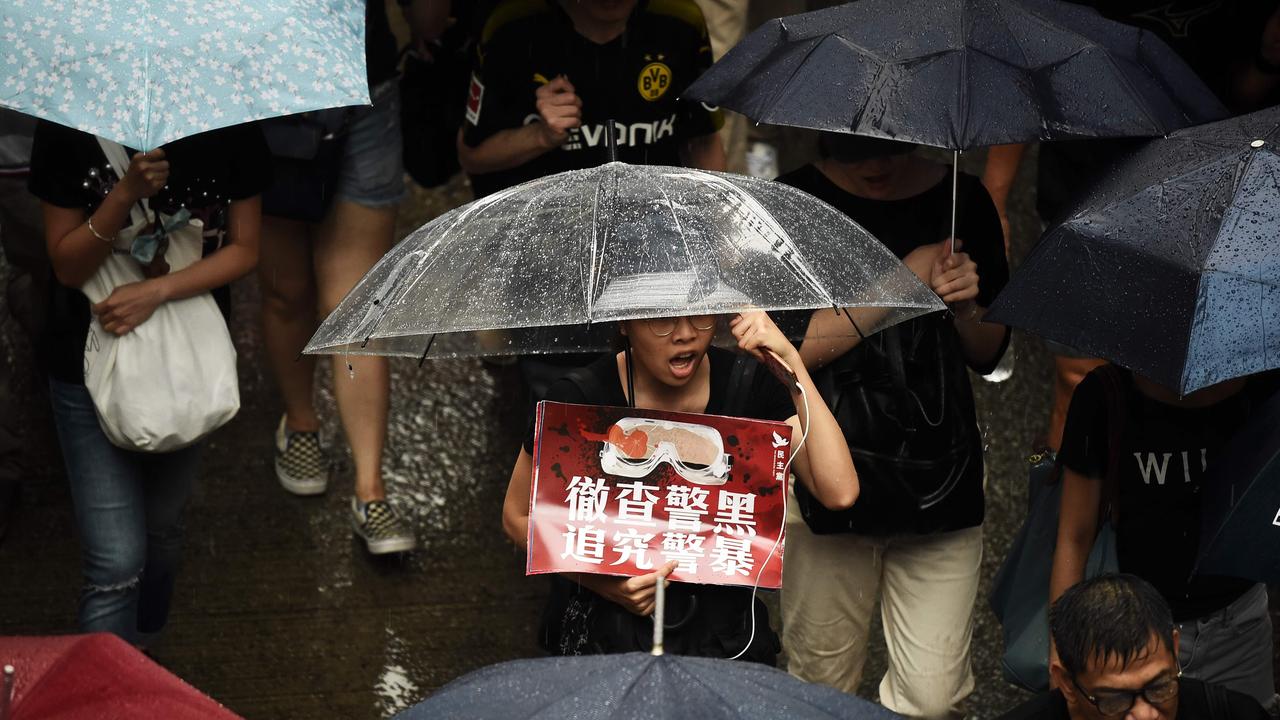 Protesters walk along a street during a rally in Hong Kong on August 18, 2019, in the latest opposition to a planned extradition law that has since morphed into a wider call for democratic rights in the semi-autonomous city. Picture: Lillian Suwanrumpha / AFP