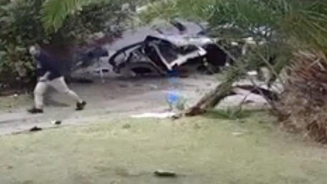 A man runs from the front half of the car towards the back half in the seconds after the crash. Pictures: Supplied