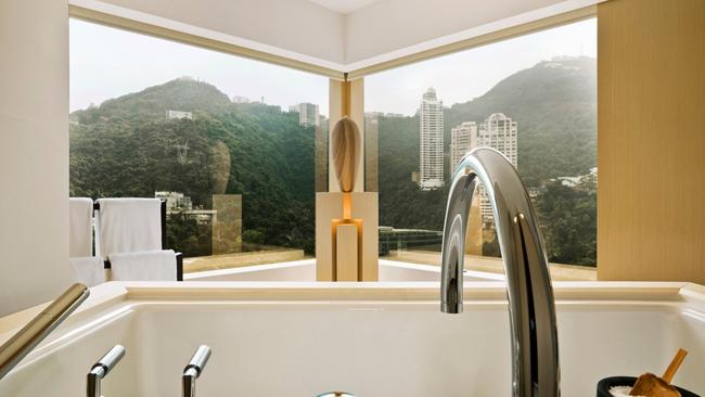 Most notable is the bathroom – it’s enormous and possibly bigger than the bedroom and living space. It’s completed by sandstone sculptures and a huge limestone tub, which I later make the most of while watching the news on the giant screen. It’s the window bench seats in the living area which offer the best vistas. Returning after a meeting, I discover a bowl of chocolates and a tray of berries waiting and as I sit down on the bench and begin to nibble, I decide this is my favourite spot in the room.