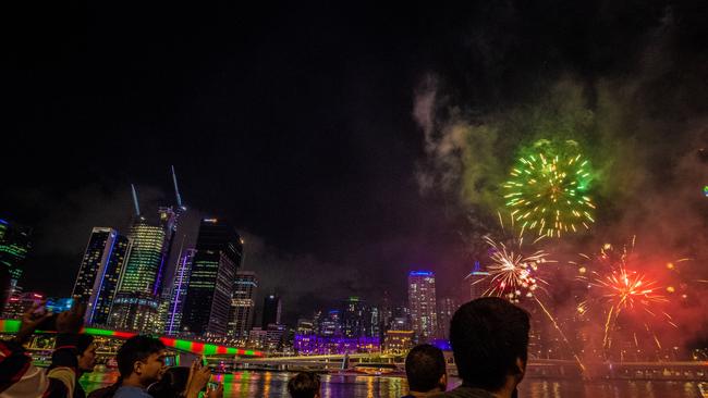 People gather to watch the skies light up. Picture: AAP/Glenn Hunt