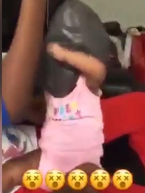 A still from the Snapchat video in which a child was filmed with a plastic bag over their head.