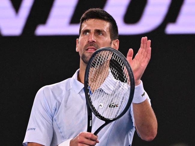 TOPSHOT – Serbia's Novak Djokovic celebrates victory over Croatia's Dino Prizmic in their men's singles match on day one of the Australian Open tennis tournament in Melbourne on January 14, 2024. (Photo by WILLIAM WEST / AFP) / -- IMAGE RESTRICTED TO EDITORIAL USE – STRICTLY NO COMMERCIAL USE --