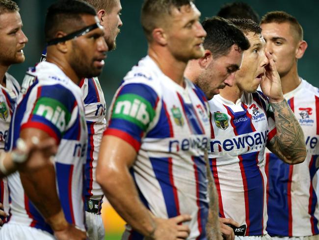 Newcastle's Trent Hodkinson and team mates after a Roosters try. Picture: Gregg Porteous