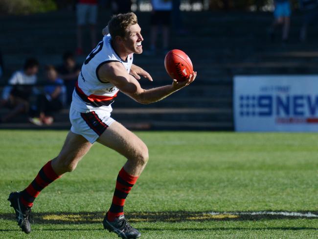 Adelaide Footy League, Division 1 Grand Final Tea Tree Gully v Rostrevor at Thebarton Oval, Saturday, September 22, 2018. Michael Coad from Rostrevor juggles the ball. (AAP Image/ Brenton Edwards)