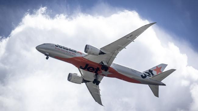 BRISBANE AUSTRALIA - NewsWire Photos SEPTEMBER 6, 2022: A Jetstar plane leaves Brisbane Airport. Hundreds of Australians are stranded in Bali after multiple Jetstar flight cancellations leave travellers scrambling to find emergency accommodation. NewsWire / Sarah Marshall