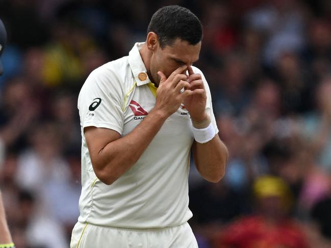 Australia's Scott Boland (R) reacts after England's Zak Crawley (L) hits a boundary off his bowling on day four of the third Ashes cricket Test match between England and Australia at Headingley cricket ground in Leeds, northern England on July 9, 2023. (Photo by Paul ELLIS / AFP) / RESTRICTED TO EDITORIAL USE. NO ASSOCIATION WITH DIRECT COMPETITOR OF SPONSOR, PARTNER, OR SUPPLIER OF THE ECB