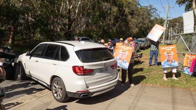 Scott Morrison’s car swiftly moved past the dozen or so protesters. Picture: Jason Edwards