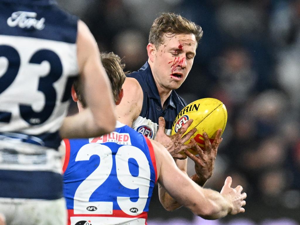 A bloodied Mitch Duncan takes possession. Picture: Daniel Pockett/Getty Images