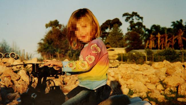 A child from the infamous Colt family. Police found 40 relatives living on a squalid southern NSW farm including inbred kids.