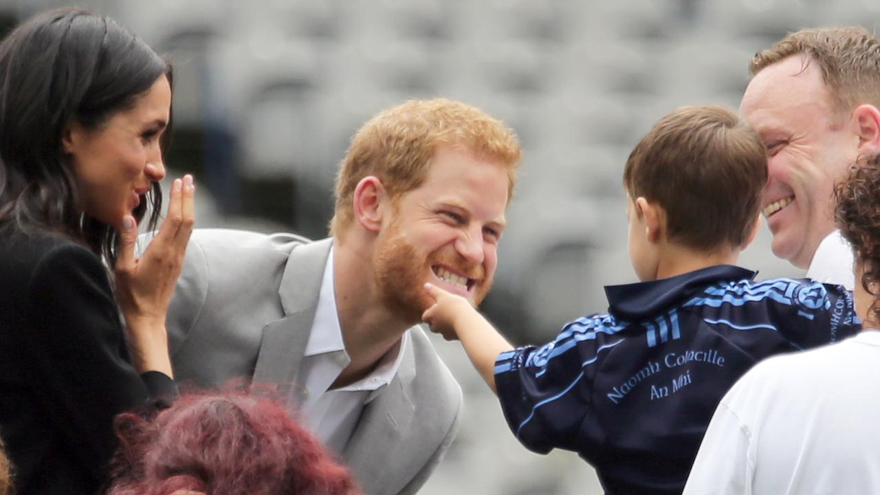 Prince Harry gets a tickle under the chin. Picture: Matrix