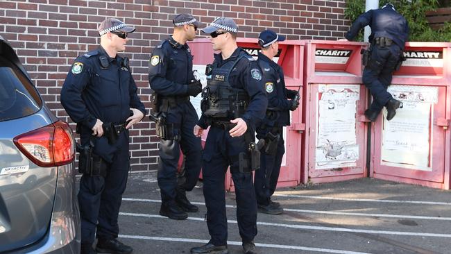 Police are seen working at the Balmain Woolworths car park where a 16-year-old boy was attacked with a knife. Picture: Peter Rae.