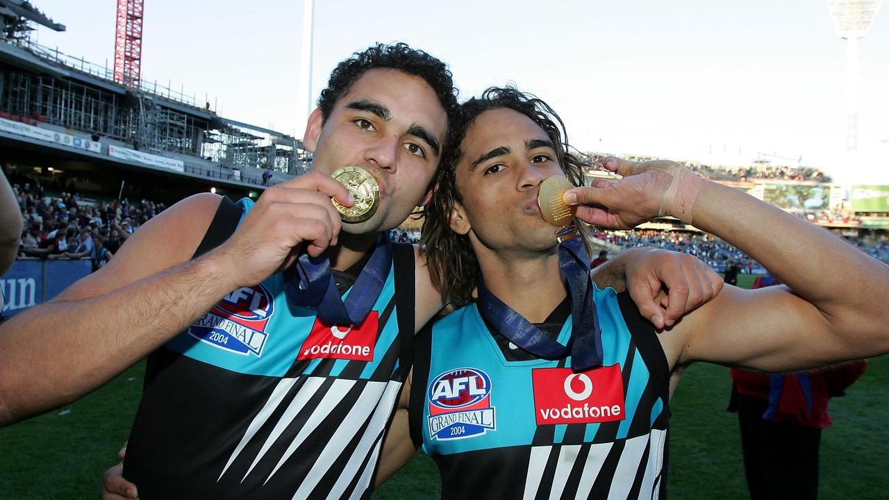 Peter Burgoyne, right, with brother Shaun after the 2004 grand final win. Picture: Ryan Pierse/Getty Images