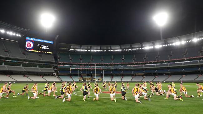 Hawthorn and Richmond players show their support of the Black Lives Matter movement.