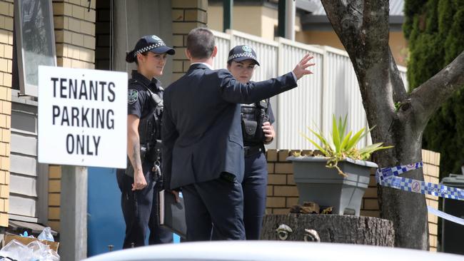 Police outside the block of units where the alleged murder took place. Picture Dean Martin