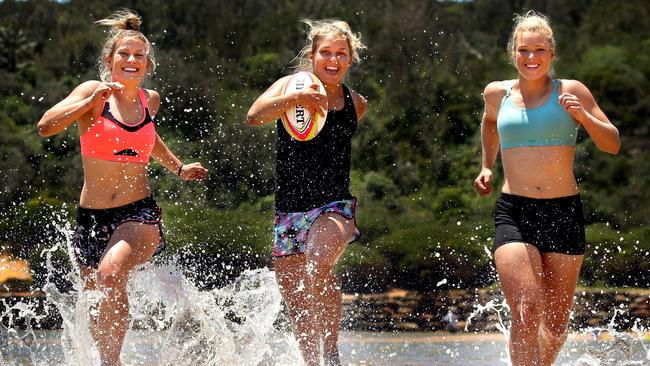 Brooke Anderson, Georgina Friedrichs and Emma Tonegato during a training session at Narrabeen Beach. Pic: Gregg Porteous