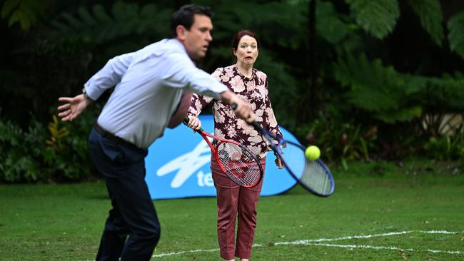 Queensland Labor MP Jess Pugh watches LNP MP Dan Purdie during a game of tennis on the Speaker's Green at Parliament House in Brisbane. Picture: NCA NewsWire / Dan Peled