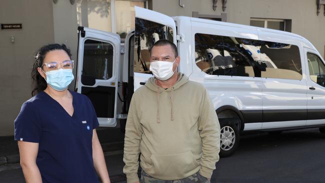 Nurse Danielle Austin and social housing resident Robert at The Vinnie’s Vax Van outside Tierney House Darlinghurst. Picture John Grainger