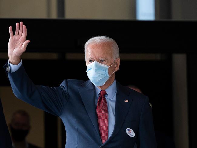 Democratic presidential candidate Joe Biden waves as he exits the state building after voting in Wilmington, Delaware. Picture: AFP